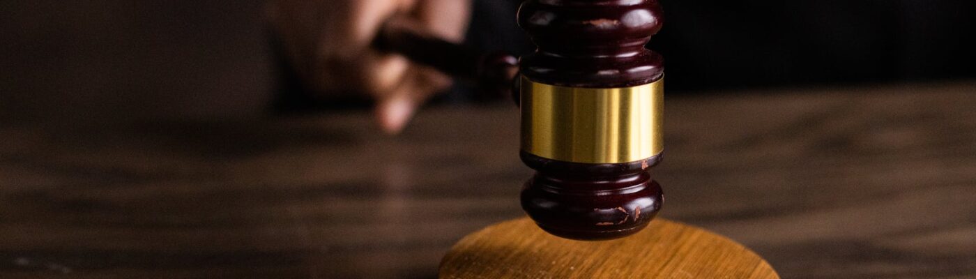 brown wooden gavel on brown wooden table